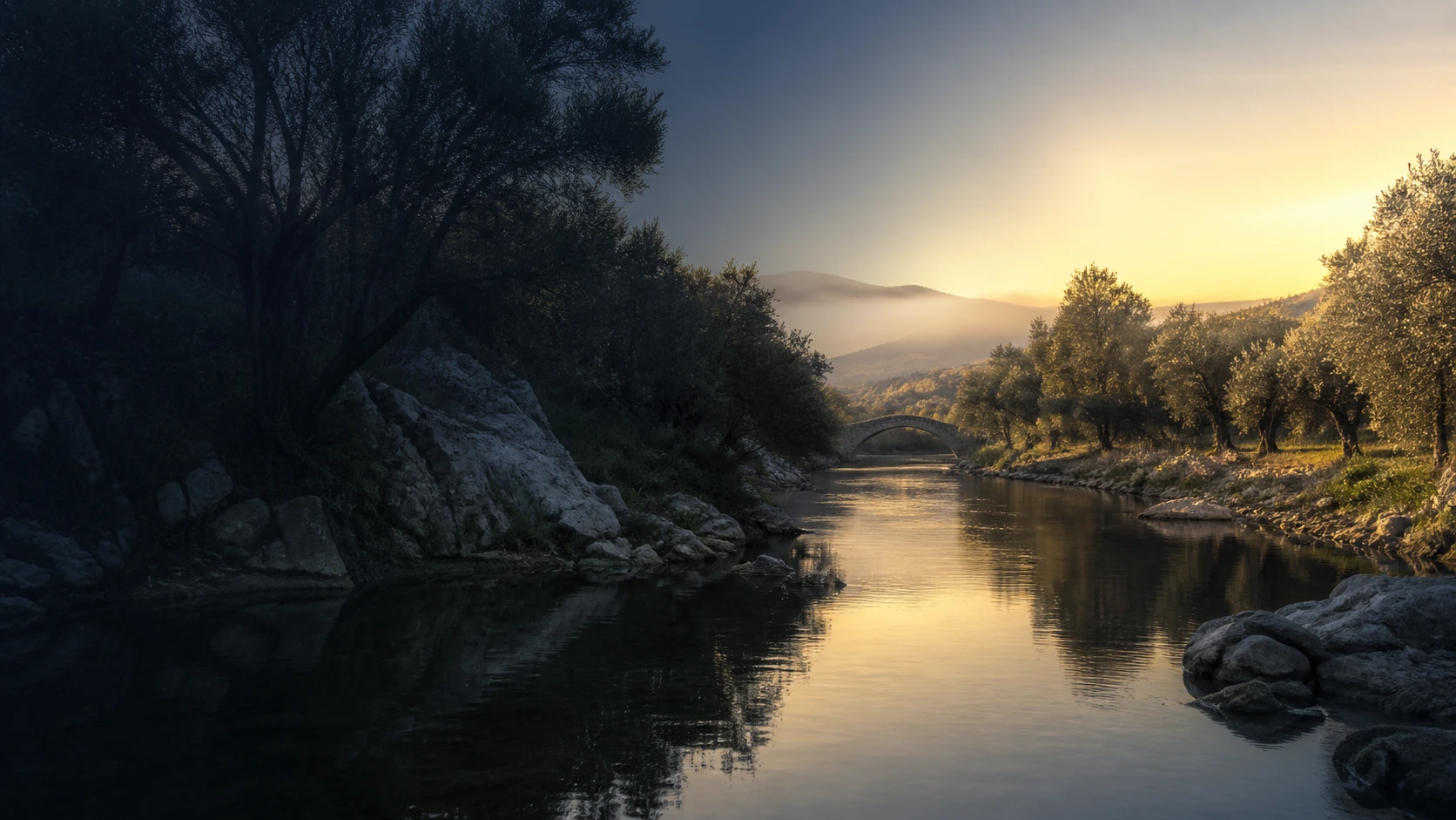 Rio entre oliveiras e colinas ao amanhecer